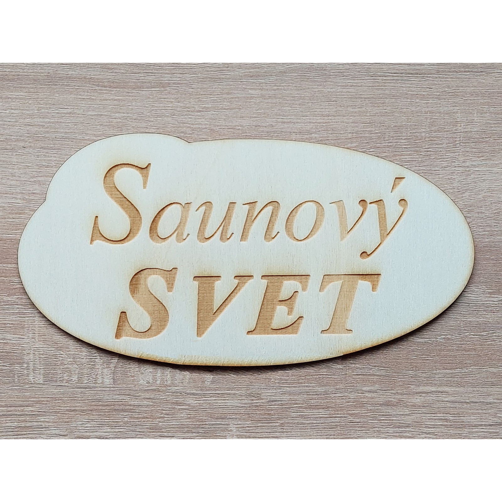 The inscription Sauna 19 cm lasered on an oval table | LYMFY.eu | Sauna